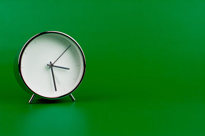 Close-up of clock against blue background
