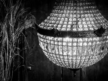 Close-up of illuminated lantern hanging in basket