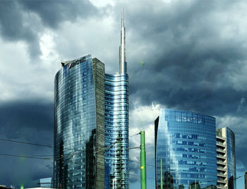 Low angle view of modern buildings against sky in city