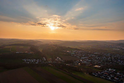 High angle view of townscape against sky during sunset