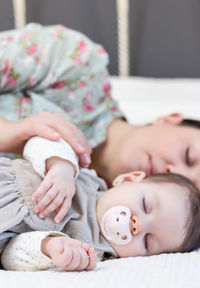 Midsection of woman lying on floor