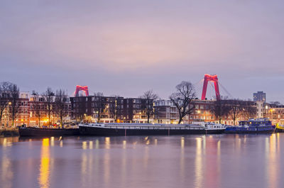 Rotterdam willemsbridge rising above island neighbourhood