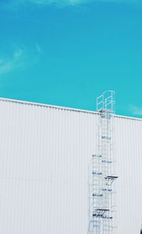 Low angle view of building against blue sky