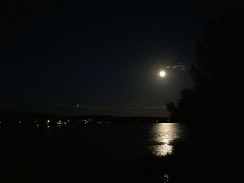 Scenic shot of illuminated landscape against sky at night