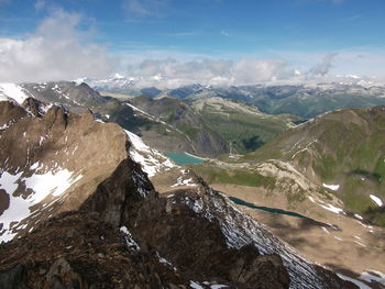 Aerial view of snowcapped mountains against sky