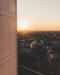 Cityscape against sky during sunset