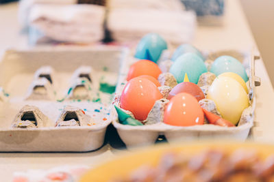 Colorful easter eggs in egg carton