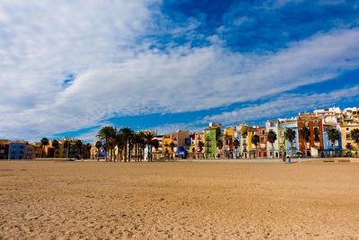 Panoramic view of beach against buildings in city