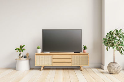 Modern interior with tv and cabinet on white color wall background.3d rendering