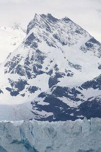 Close-up of snow on mountain against sky