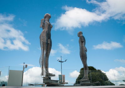 Low angle view of statue of building against sky