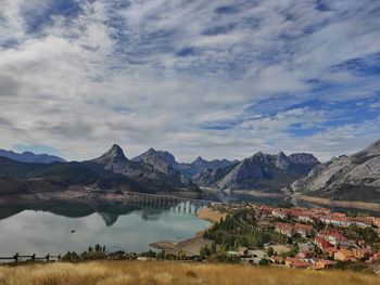 Scenic view of lake and mountains against sky