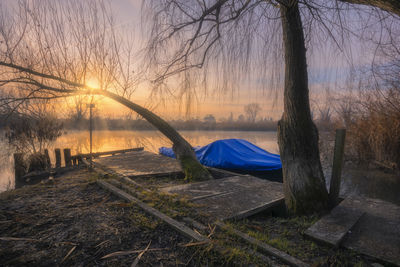 Scenic view of lake against sky during sunset