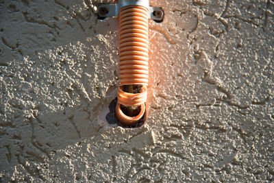 High angle view of water pipe on wall