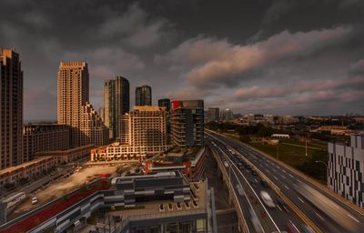 High angle view of street amidst buildings against sky