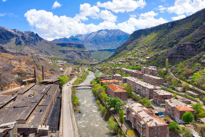 High angle view of road amidst mountains against sky