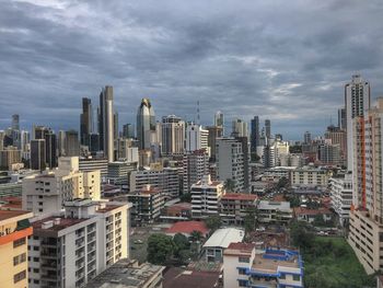 High angle view of buildings in city against sky