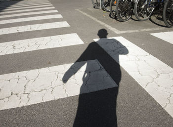 High angle view of man shadow on street