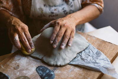 Midsection of man making food