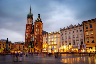 Buildings in city at dusk