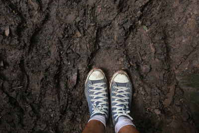 Low section of person standing on ground