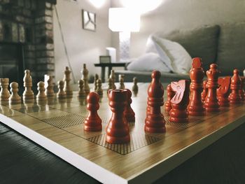 Close-up of chess pieces on table