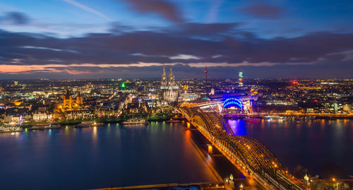 Illuminated city at waterfront