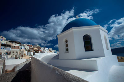 Old church in town against sky at santorini