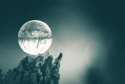 Close-up of crystal ball against clear sky