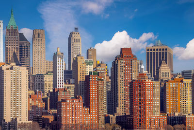 Modern buildings in city against sky