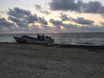 Scenic view of sea against cloudy sky