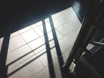 Close-up of shadow on tiled floor