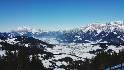 Scenic view of snowcapped mountains against clear sky