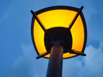 Low angle view of yellow light against sky