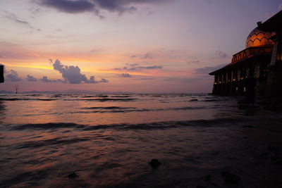 Scenic view of sea against sky at sunset