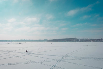 Scenic view of snow covered landscape against sky