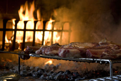 Close-up of meat roasting on barbeque grill