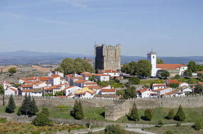 Buildings in city against sky