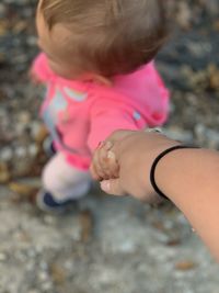 Close-up of baby hand on rock