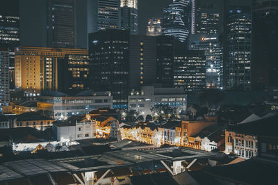 High angle view of illuminated buildings in city at night