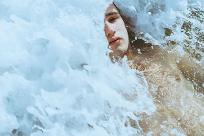 Portrait of man swimming in sea