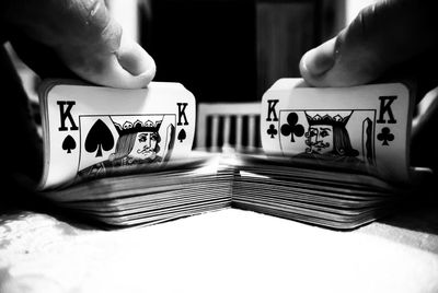 Close-up of hands shuffling cards
