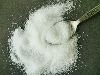 Close-up of a spoon with sugar granules