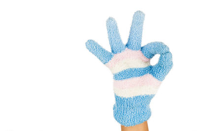 Close-up of human hand against white background