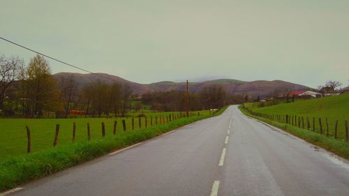 Road passing through field