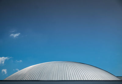 Low angle view of built structure against blue sky