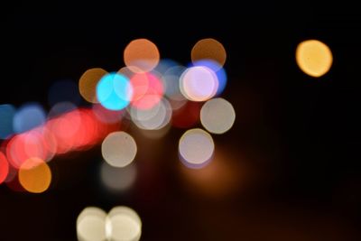 Defocused image of illuminated lights at night