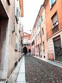 Narrow alley amidst buildings in city