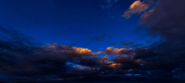 Low angle view of dramatic sky at night