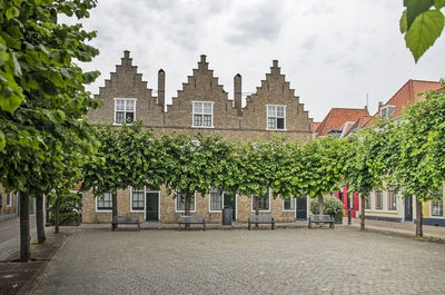 Square with trees and facades in vlissingen